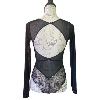 Back of Black long-sleeve top with lace detailing on a mannequin against a white background