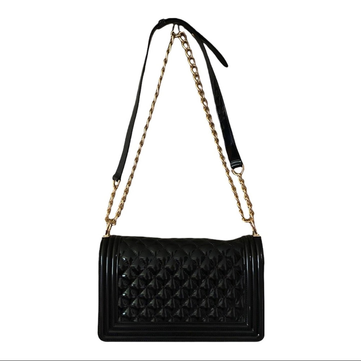 Back of Black quilted handbag with a gold chain strap on a white background