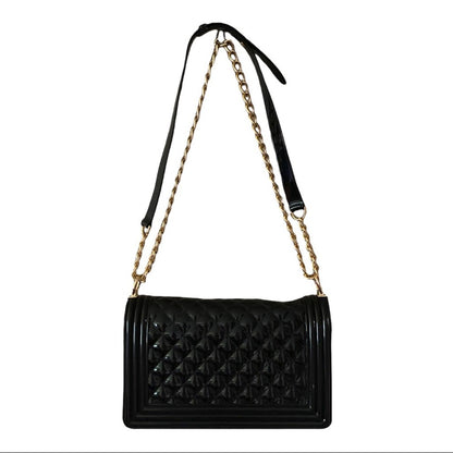 Back of Black quilted handbag with a gold chain strap on a white background