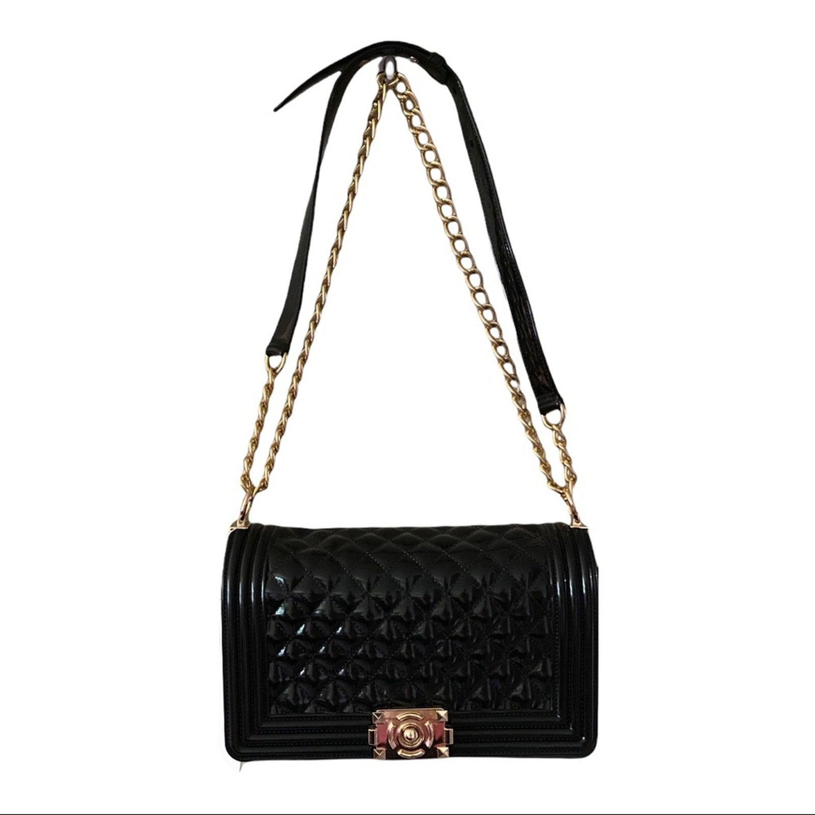 Front of Black quilted handbag with gold chain strap on a white background