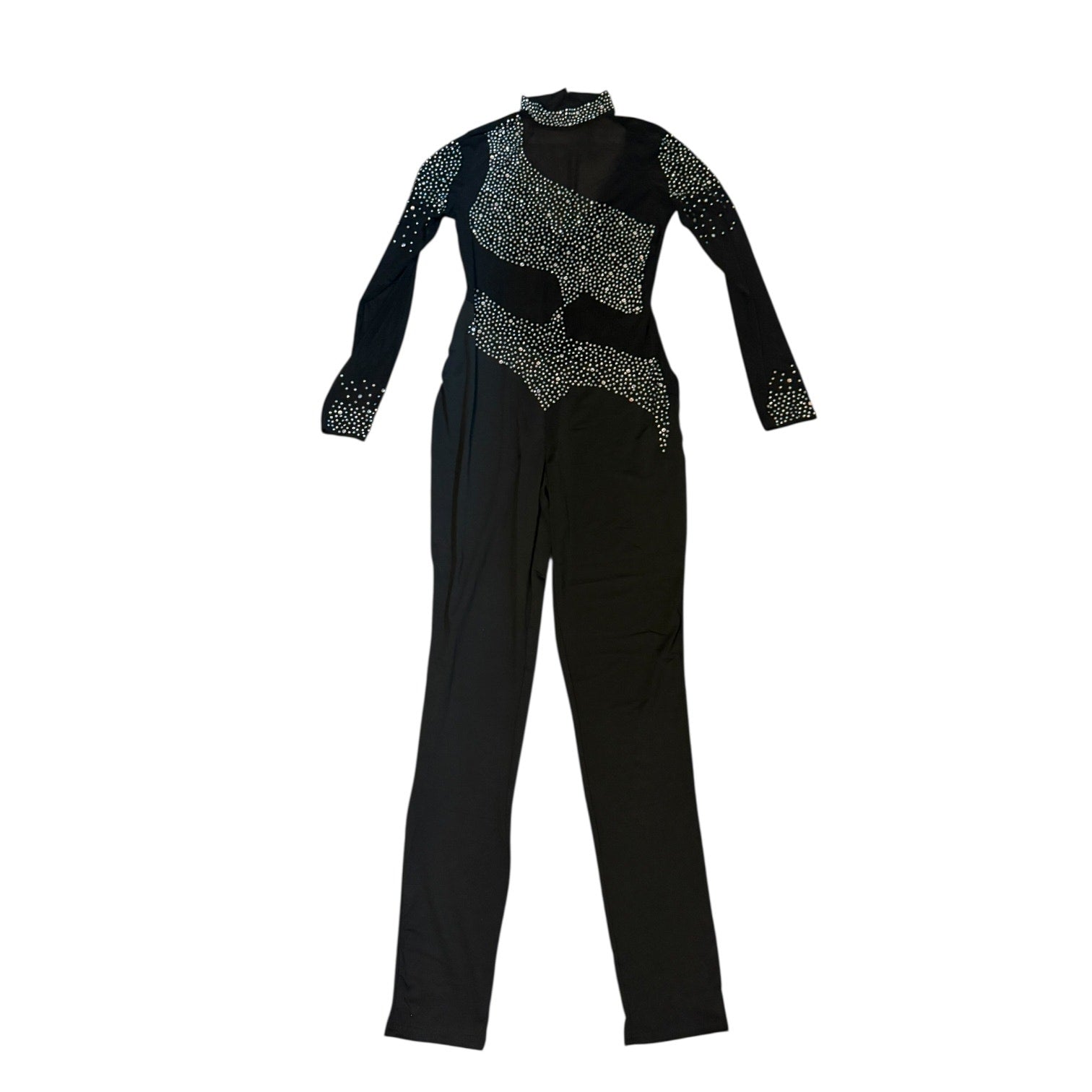Black catsuit laying out with  embellishments on a white background