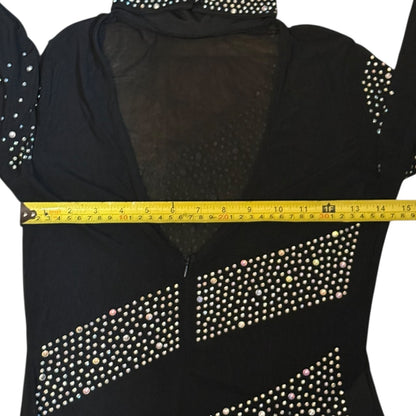 Black catsuit with rhinestone details being measured with a yellow tape measure.