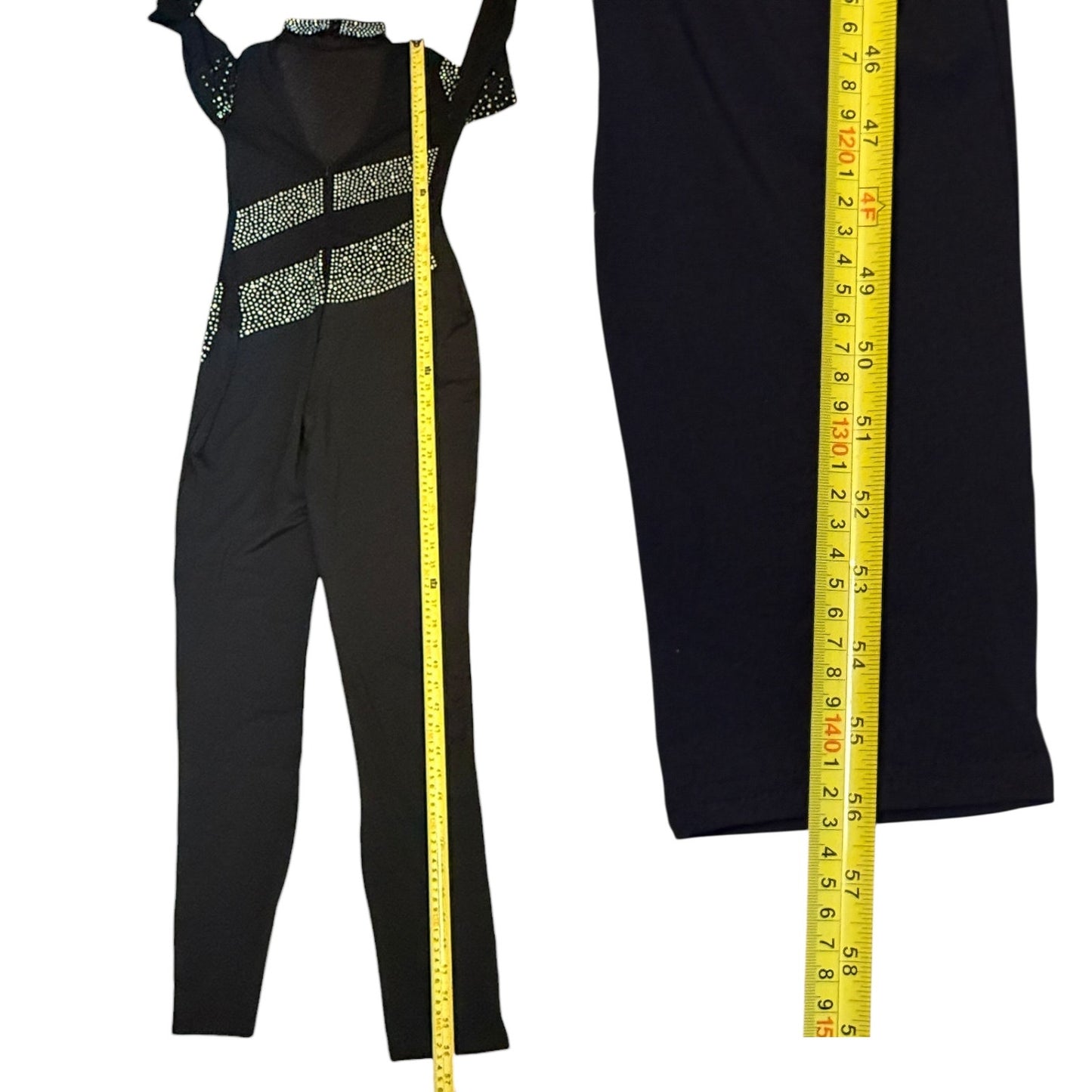 Black catsuit with a yellow measuring tape for size reference on a white background