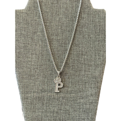 Necklace with a 'P' pendant on a gray bust