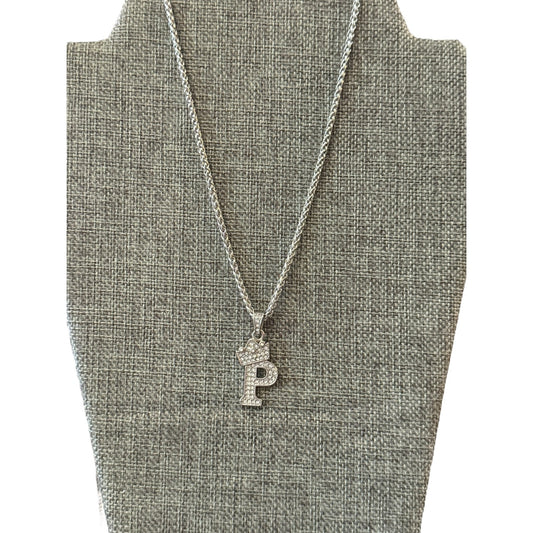 Necklace with a 'P' pendant on a gray bust