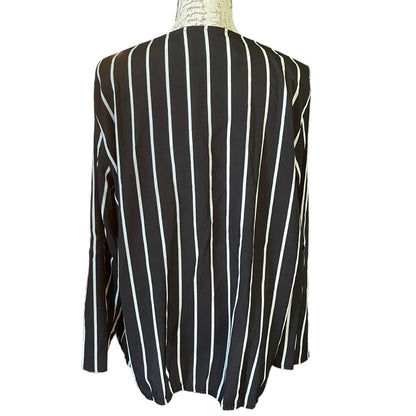 Back of Black and white striped shirt on a mannequin with a white background