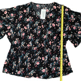 Length of black floral shirt