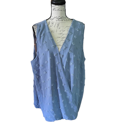 Blue sleeveless top on a mannequin with a white background