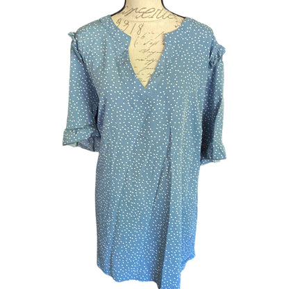 Front of Blue polka dot dress on a mannequin with a white background
