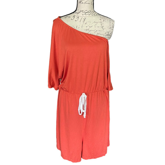 Front of orange romper on a mannequin with a white background