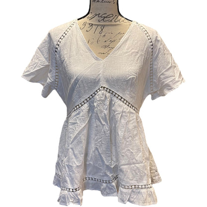 Front of White lace top on a mannequin with a white background
