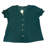 Green shirt laying flat