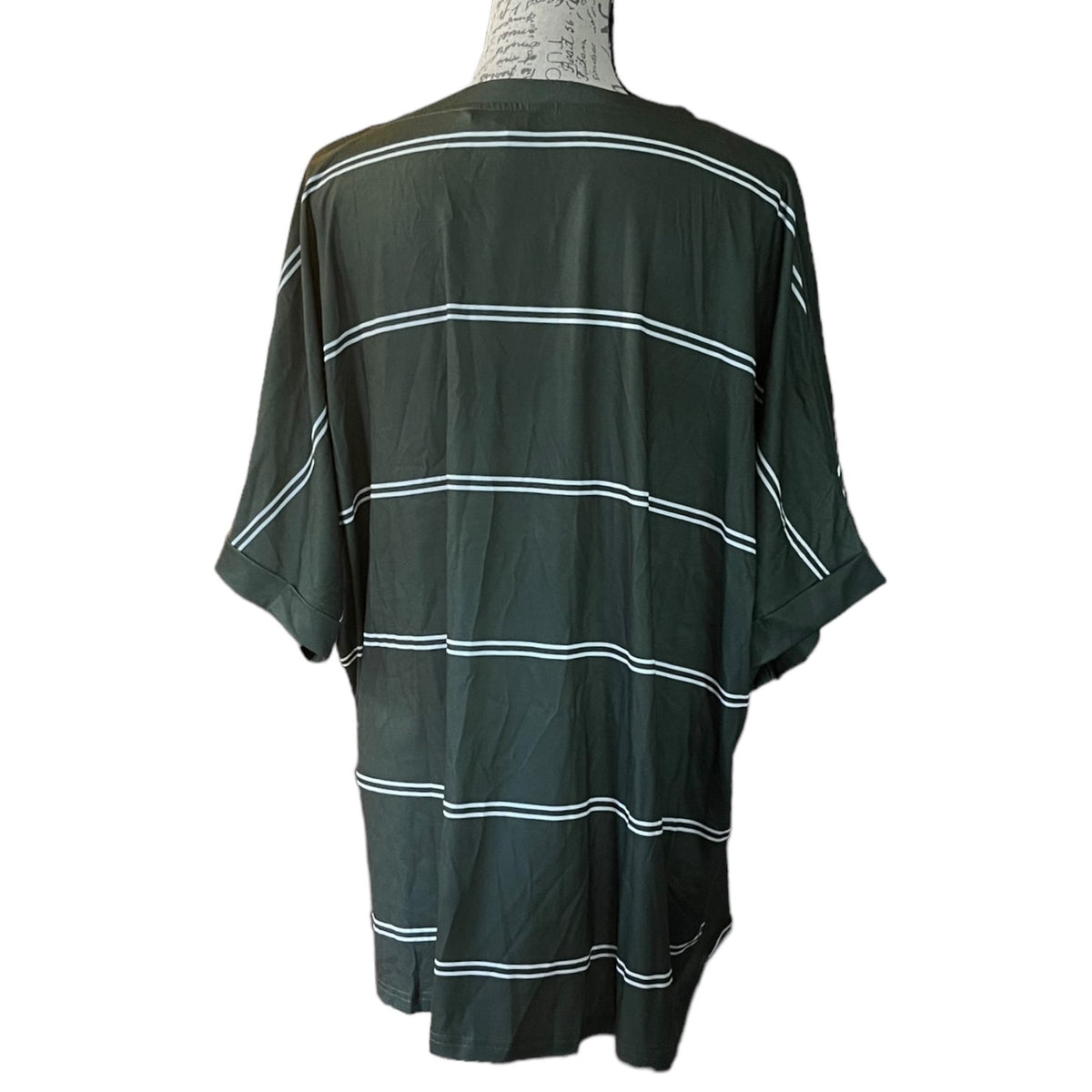 A dark green short-sleeve t-shirt with thin white horizontal stripes, shown from the back on a mannequin torso against a white background.