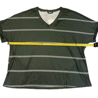 An dark green V-neck t-shirt with thin white horizontal stripes, shown flat-laid with a yellow measuring tape stretched across the chest to indicate width.