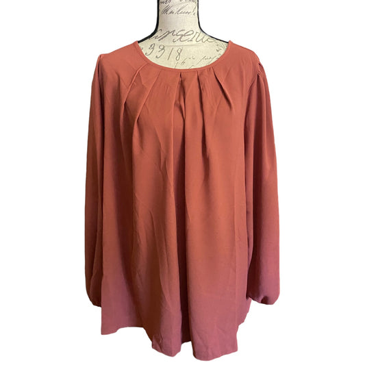 A long-sleeve blouse with a gathered, pleated neckline, displayed on a vintage-style dress form mannequin against a plain white background.
