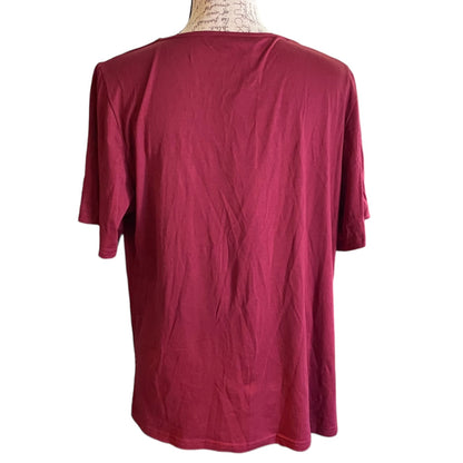 Back of maroon colored shirt, displayed on a mannequin torso against a plain white background.