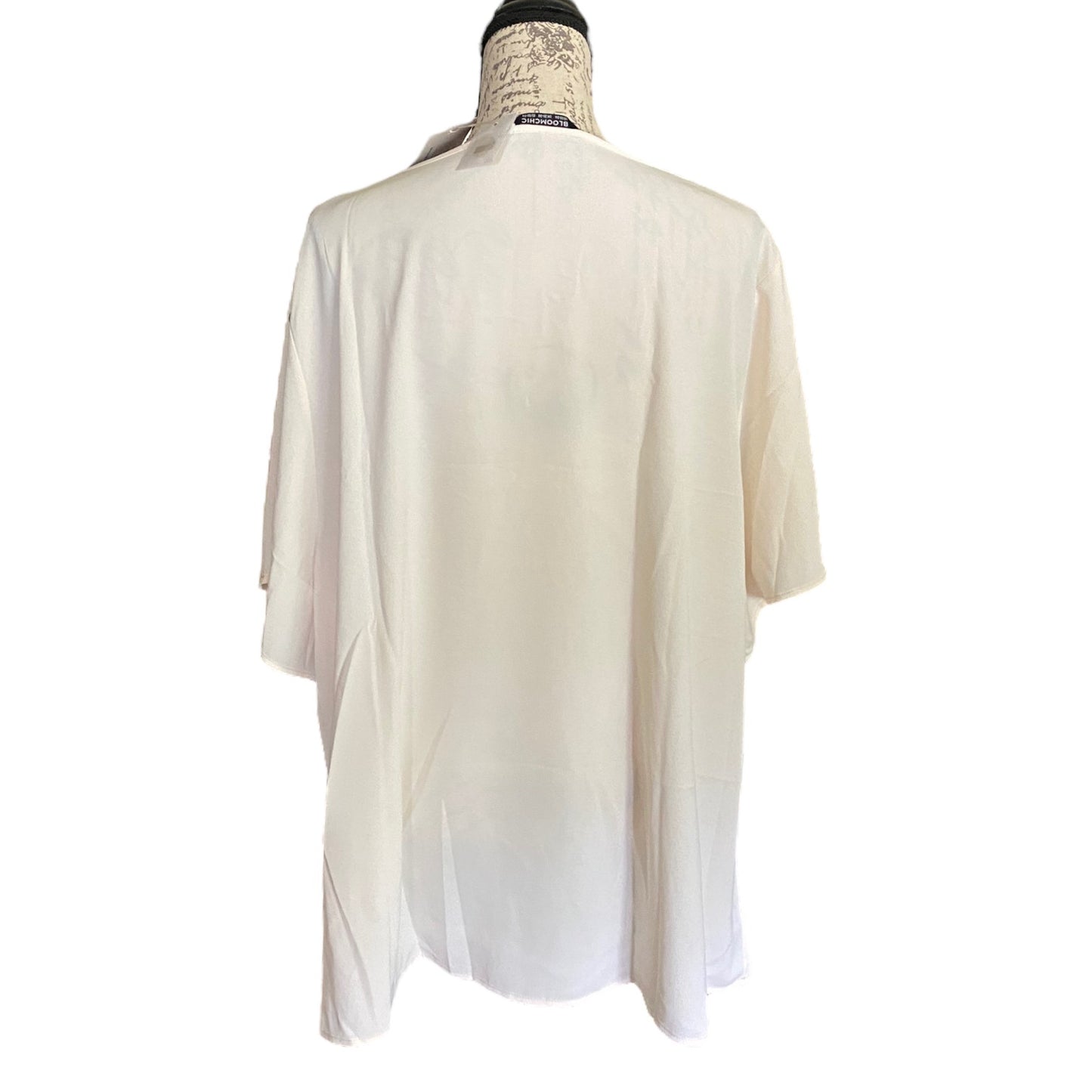 Back of off White blouse on a mannequin with a white background