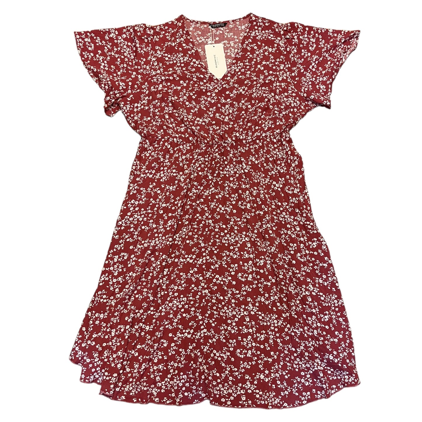 Red floral dress with a tag on a white background