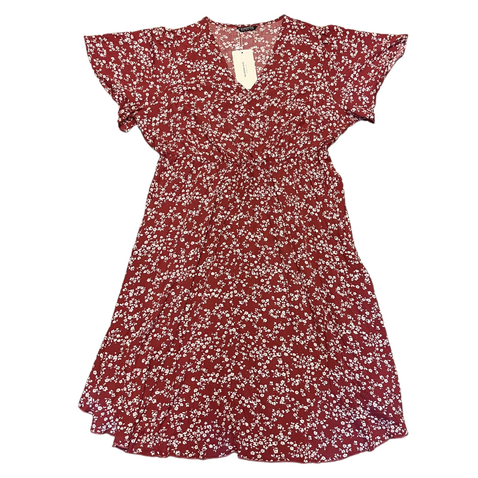 Red floral dress with a tag on a white background