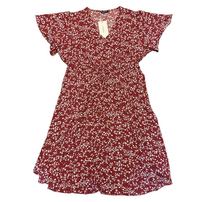 Red floral dress with a tag on a white background