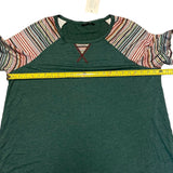 Pit to pit on green shirt
