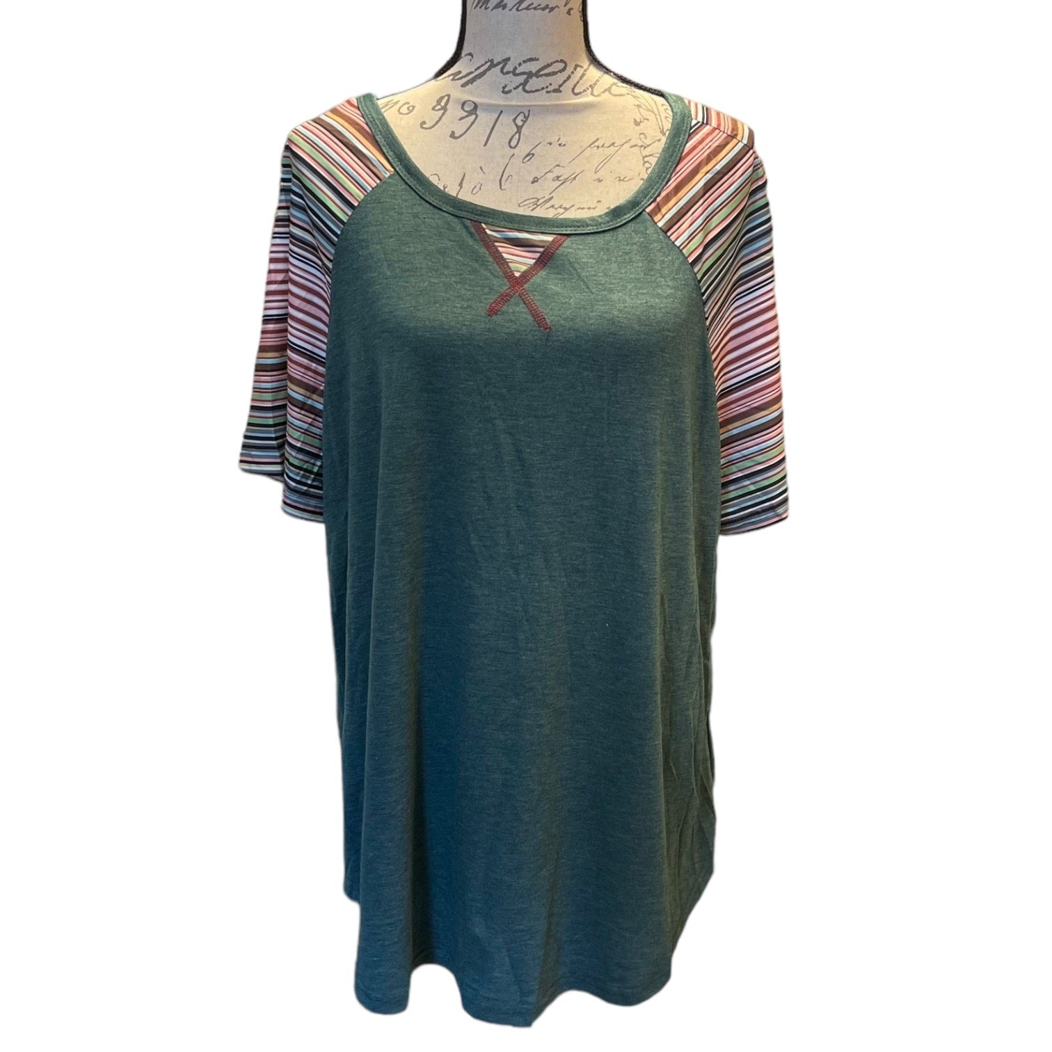 Front of Green dress with striped sleeves on a mannequin against a white background