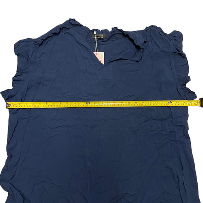 Navy blue shirt with ruffled sleeves and a measuring tape on a white background