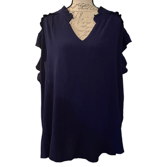 Navy blue top with ruffled sleeves on a mannequin against a white background
