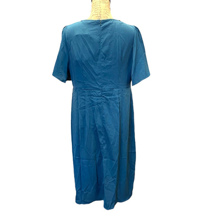Blue dress on a mannequin against a white background
