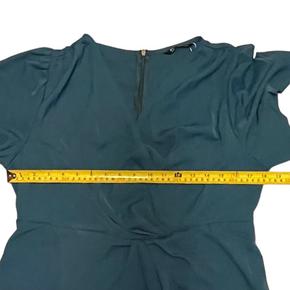 dress with a measuring tape laid across it on a white background