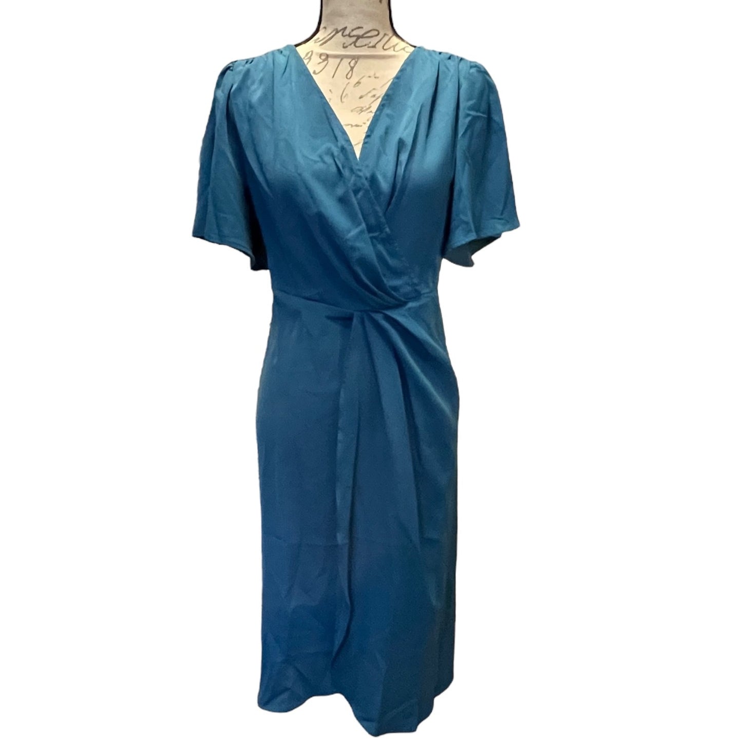 Blue dress on a mannequin against a white background