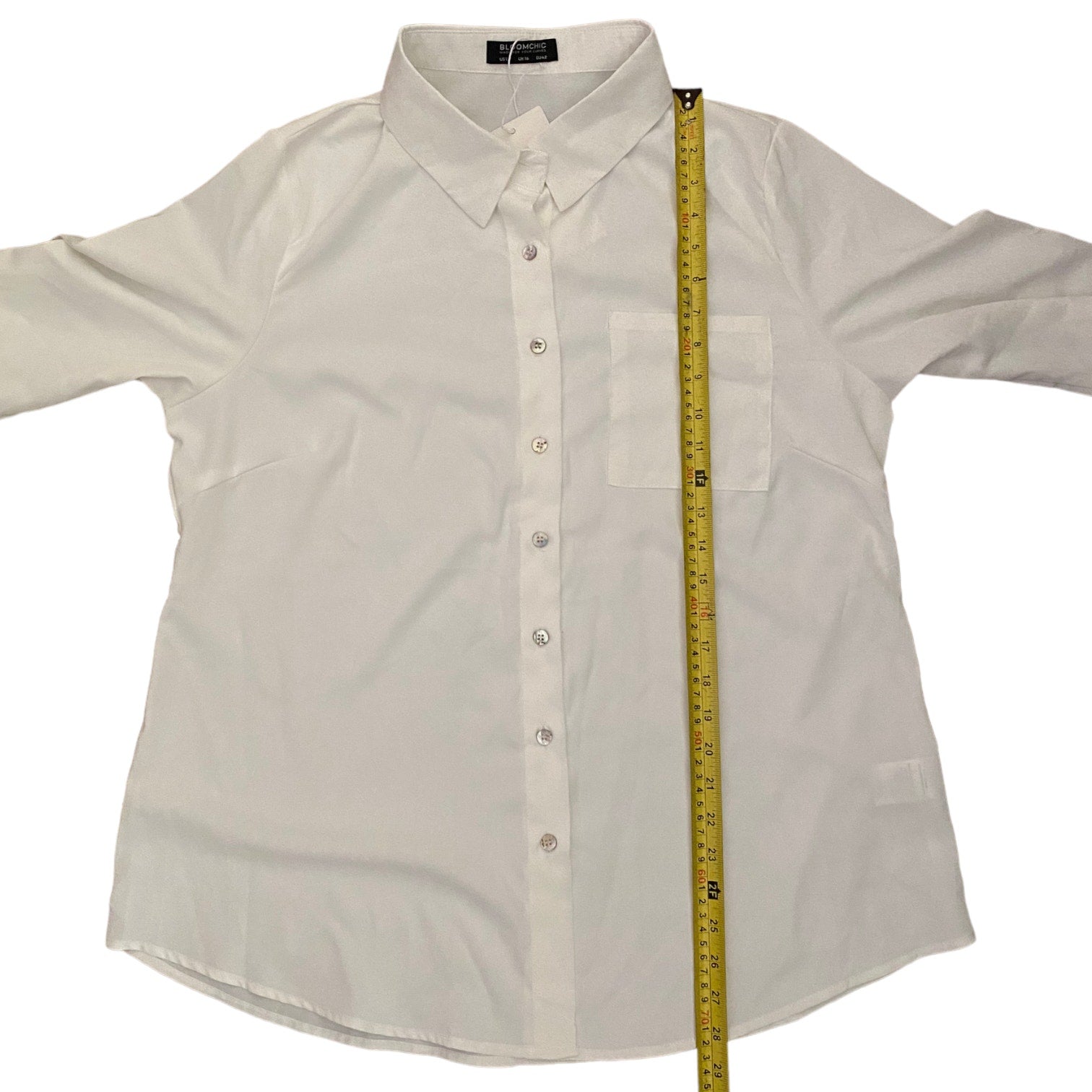 White shirt with a measuring tape on a white background