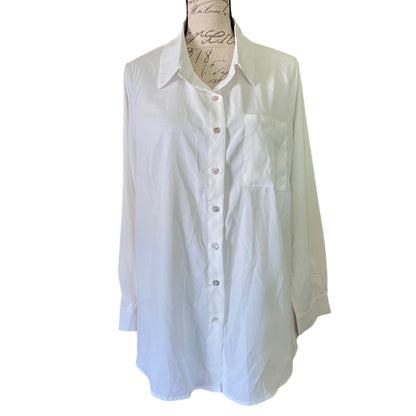 Front of White button-up shirt on a mannequin against a white background