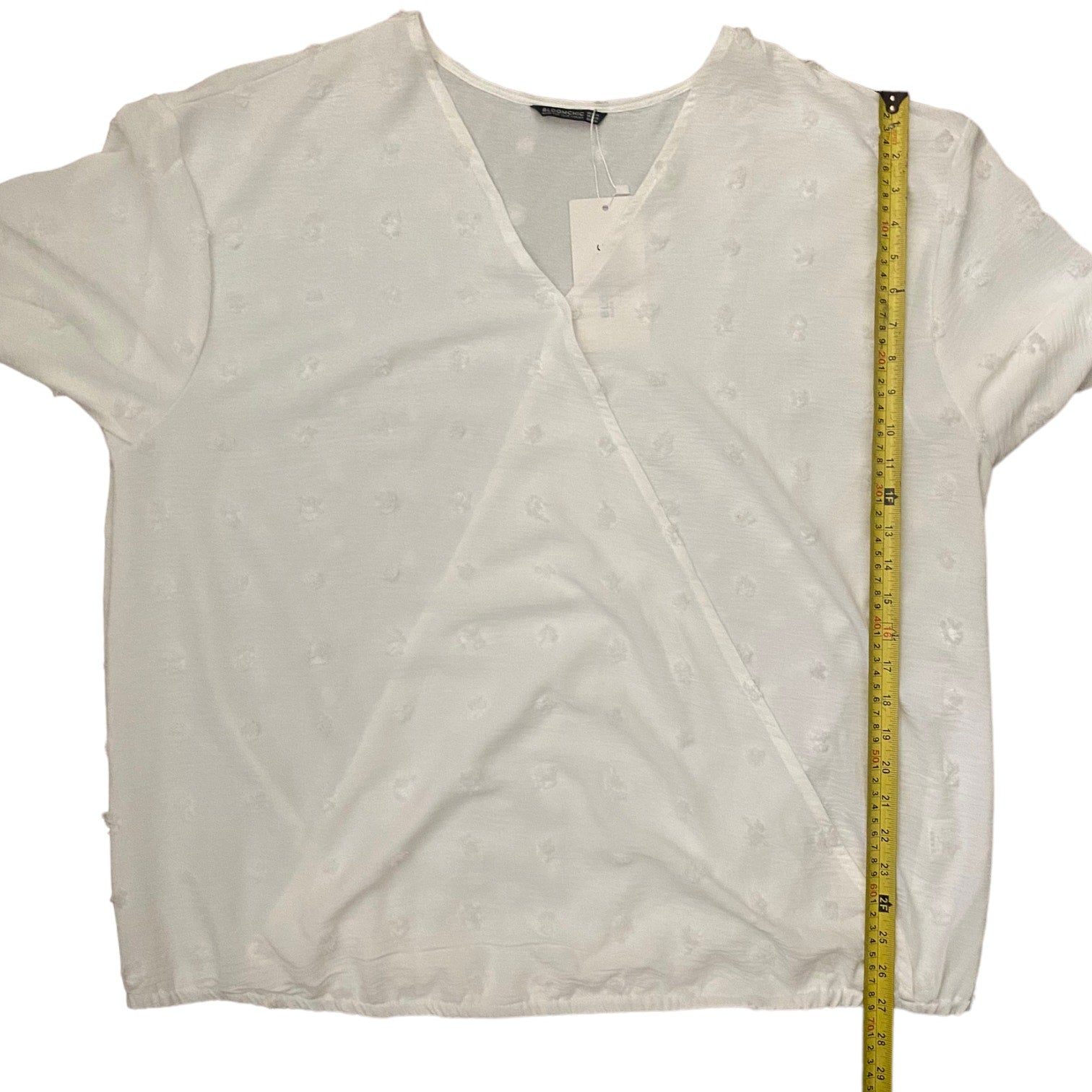 White blouse with a measuring tape on a white background