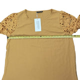 Pit to pit of yellow shirt