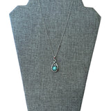 Blue faux pearl necklace set in silver view on neck board