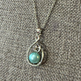 Blue faux pearl necklace set in silver side view