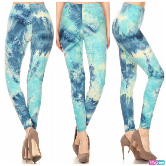 Blue and white tie-dye leggings worn by a person on a white background