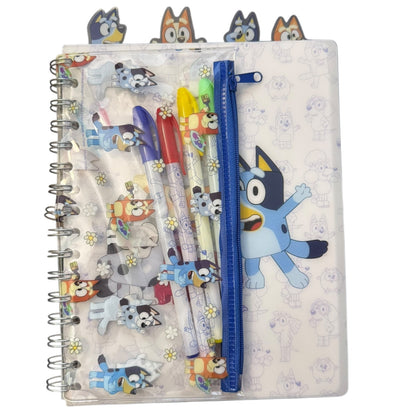 Notebook with cartoon character design and pens peeking out, on a white background