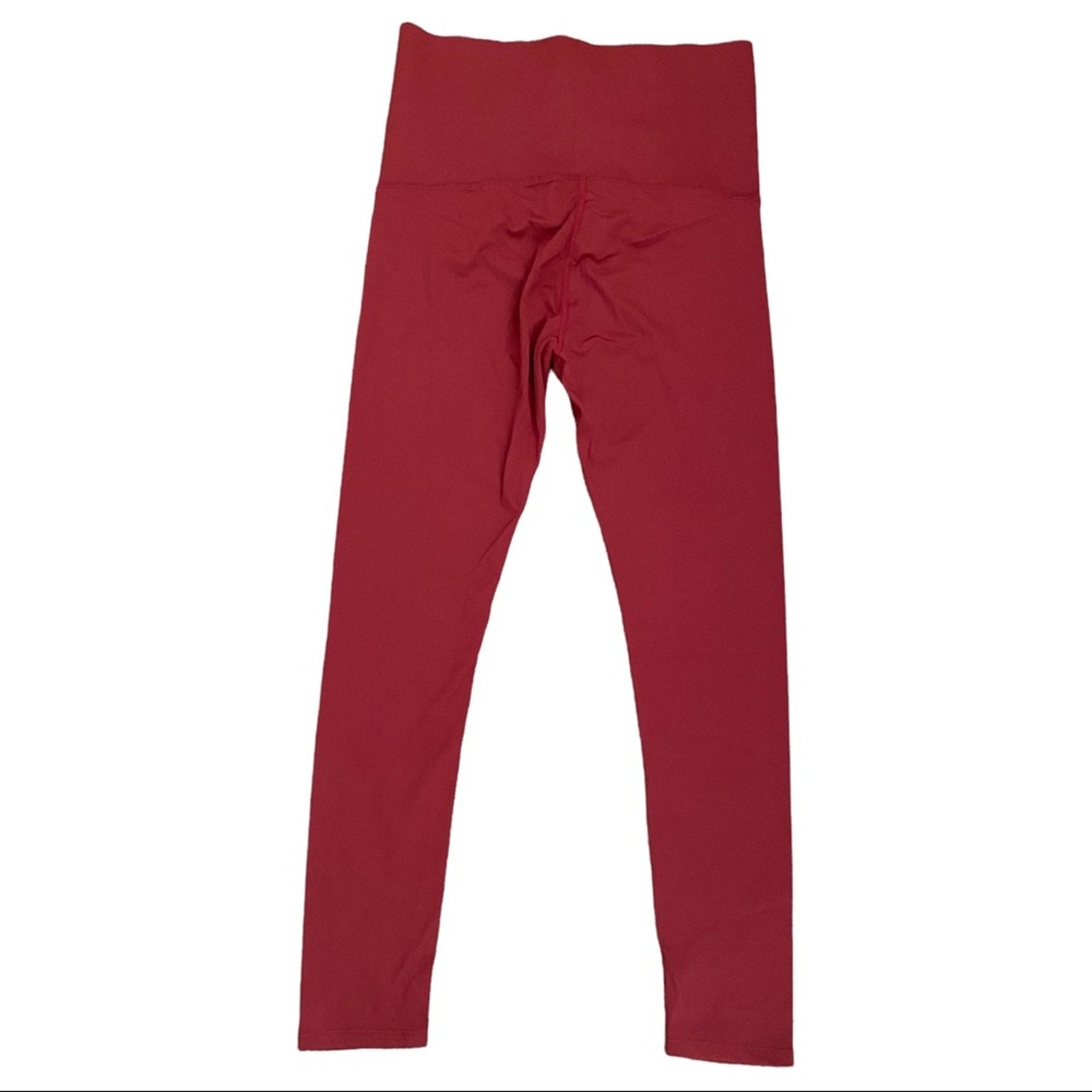 A pair of high-waisted, solid burgundy leggings laid flat against a plain white background.