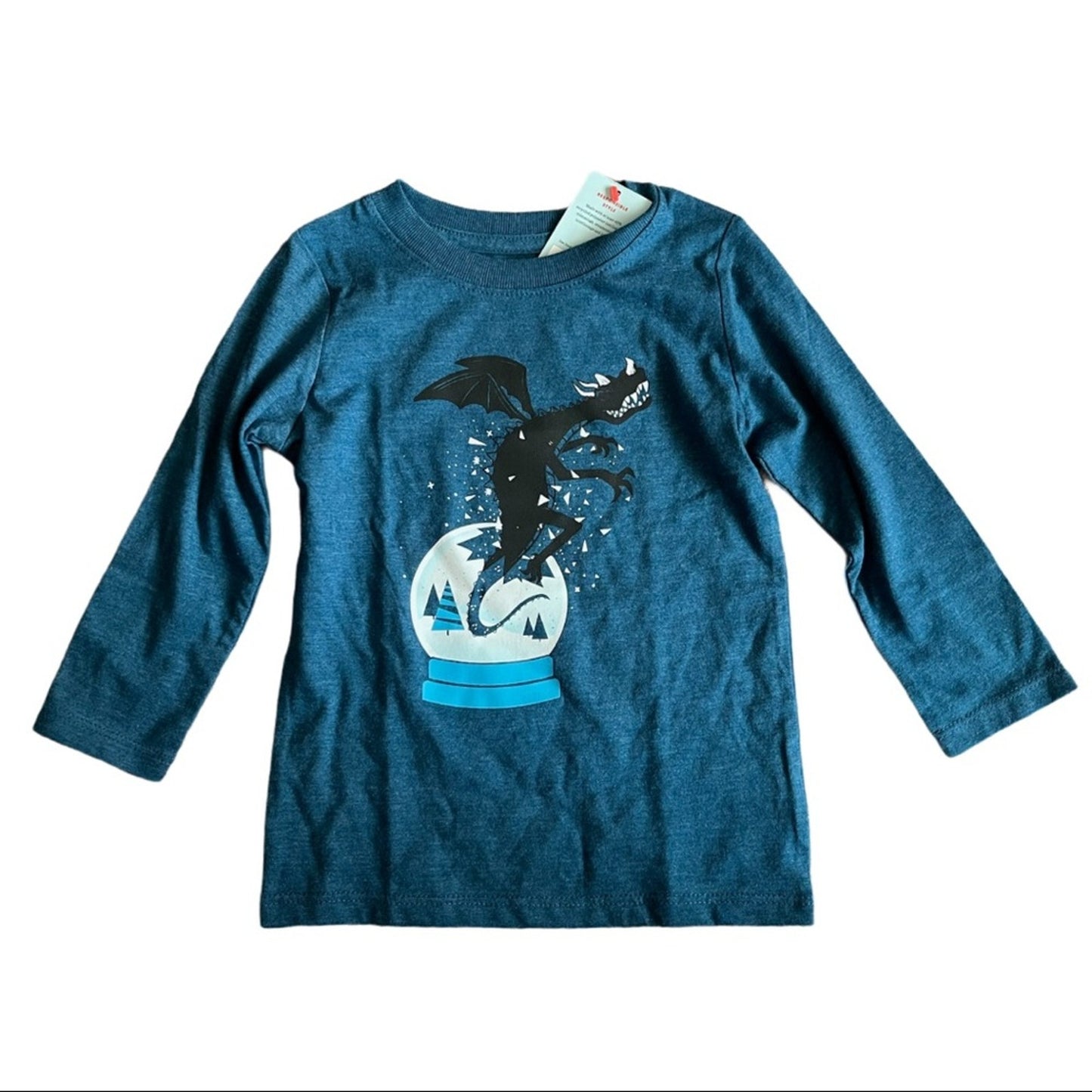 Blue long-sleeve shirt with a graphic design of a dragon in a snow globe on a white background.