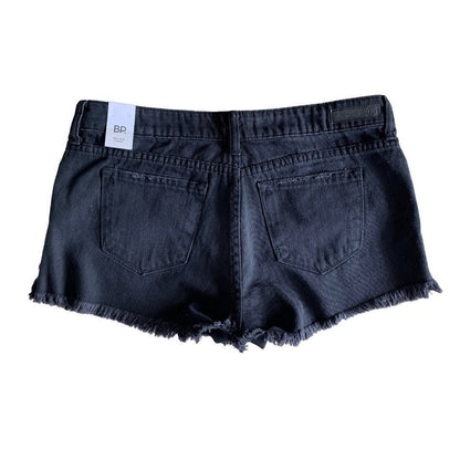 Back of Black denim shorts with frayed edges on a white background