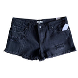 Front of Black denim shorts with frayed edges on a white background
