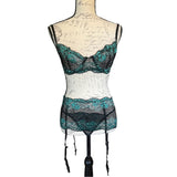 Black lace lingerie set on a mannequin with a white background