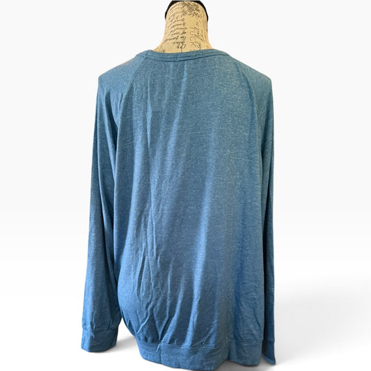 A blue long-sleeve shirt displayed on a mannequin torso against a plain white background.