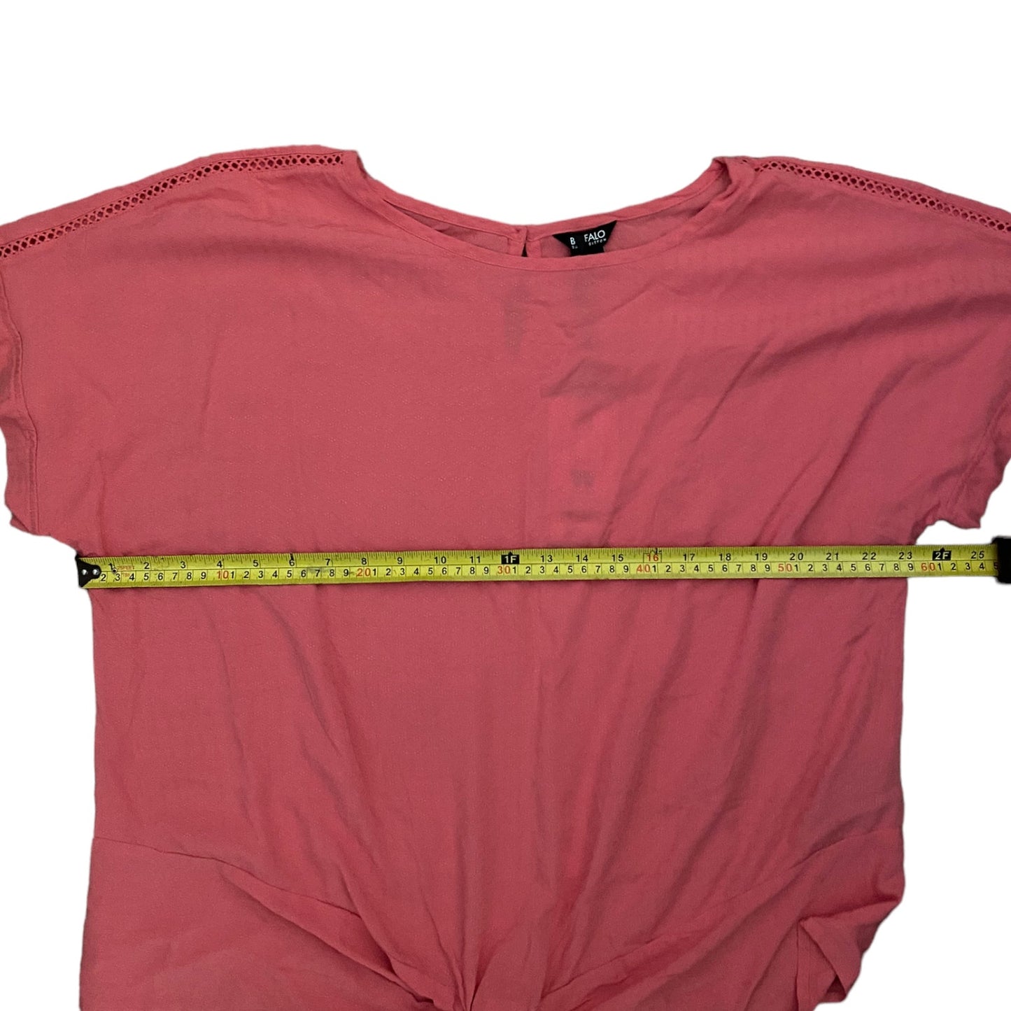 shirt with a measuring tape across it on a white background