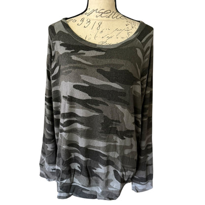 Front of Camouflage-patterned long-sleeve top on a mannequin with a white background