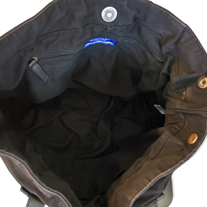 Interior of black tote with a brand logo on a white background