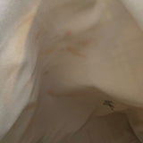 Close-up of beige fabric with stains .