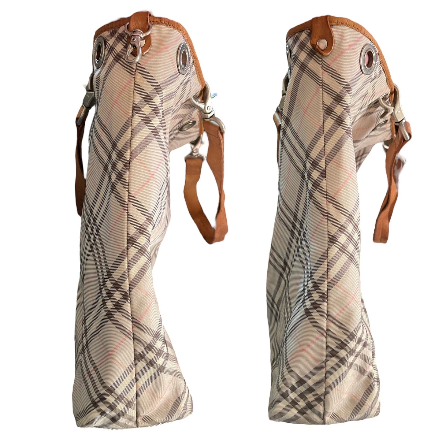 Side of Plaid patterned bag with brown leather straps on a white background